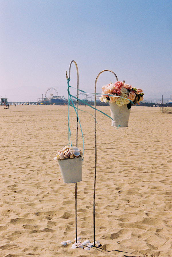 pink and white beach wedding floral decor photo by Yvette Roman Photography